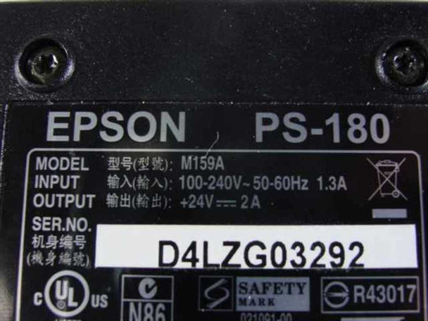 Epson PS-180 M159A label showing model, input 100-240V 50-60Hz 1.3A, output +24V 2A, serial number, and UL/safety certifications