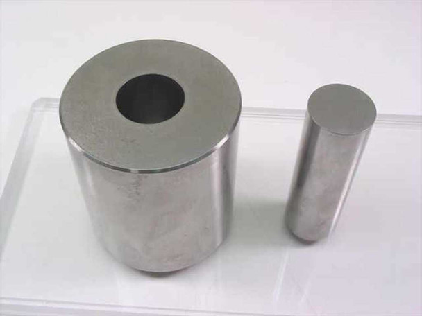 South Bay Technology die set — hollow cylindrical die and matching punch rod, close-up view showing bore and machined surfaces