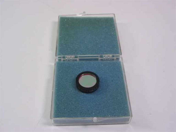 Ealing Corp 35-3961 bandpass filter in open clamshell case showing green anti-reflection coating side of the filter element