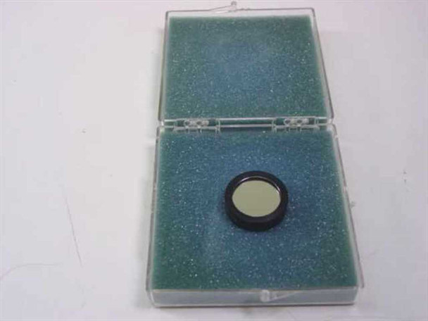 Ealing 35-3441 bandpass optical filter resting in open foam-lined Ealing plastic case — filter visible in lower foam recess