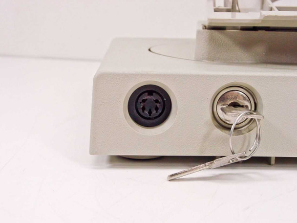 IBM 3191 Logic Base – close-up of left side showing 5-pin DIN port and security lock with keys inserted