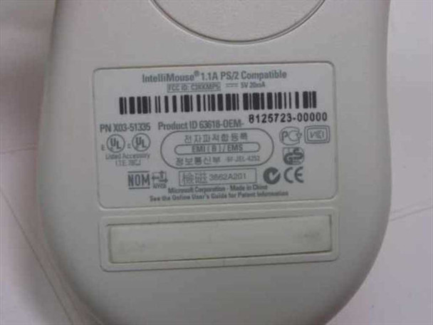 Microsoft IntelliMouse X03-51335 bottom label showing model X03-51335, Product ID 63618-OEM, IntelliMouse 1.1A PS/2 Compatible, 5V 20mA, FCC, UL, CE, and NOM certifications