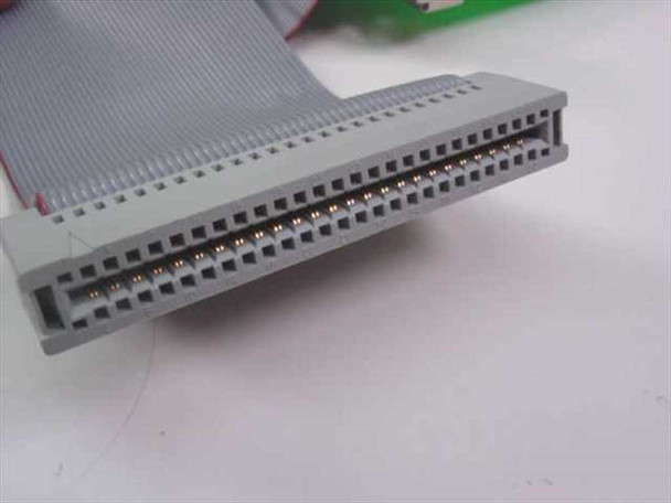 Close-up of 50-pin IDC ribbon cable connector end showing dual-row pin contacts