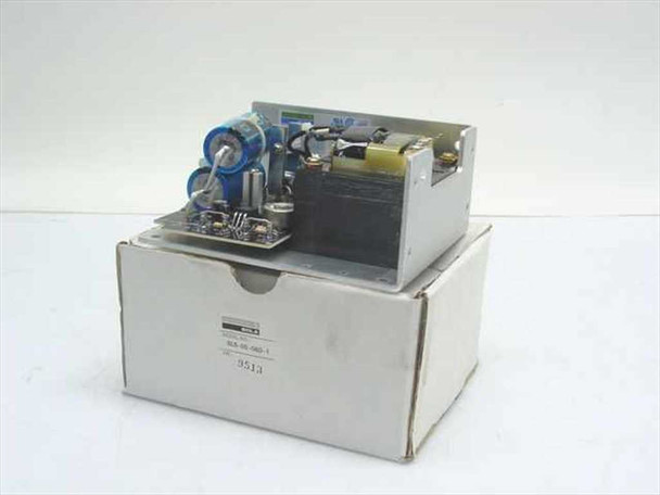 Sola SLS-05-060-1 Regulated Power Supply shown removed from its original white cardboard box, front and top view