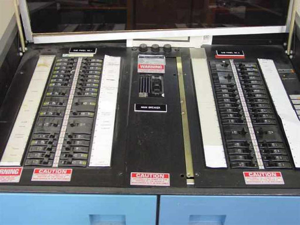 Topaz MN1C-AD075 interior top – main breaker panel open showing Sub Panel 1 and Sub Panel 2 circuit breakers and central main breaker with warning labels