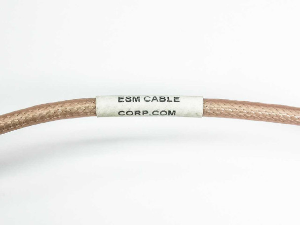 Close-up of ESM Cable Corp label on RGS-400 coaxial cable showing manufacturer name