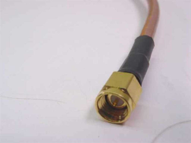 ESM Cable Corp RG-400 close-up of SMA-Male connector — gold-plated body with center pin, black strain relief boot