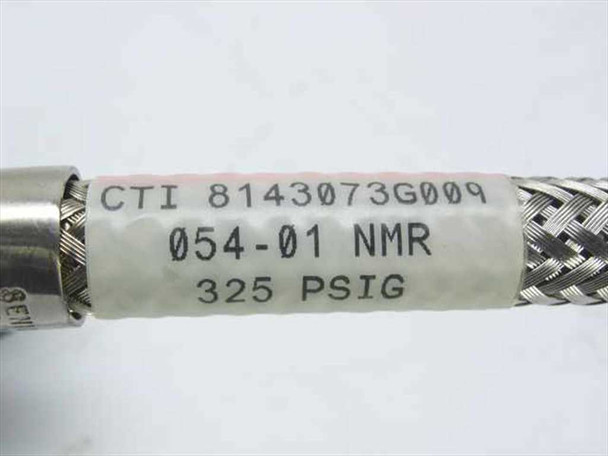 Close-up of CTI 8143073G009 label on braided cryogenic cable showing part number, 054-01 NMR designation, and 325 PSIG pressure rating