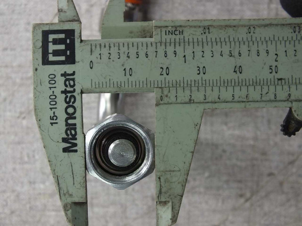 Caliper measurement of Aeroquip 5400-S5-4 male nut connector on CTI 8143073G009 cryogenic cable showing approximately 3/4-inch nut diameter