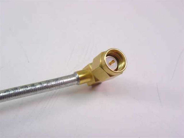 Harbour Industries 200086-014 close-up of right-angle male SMA connector with gold-plated brass body