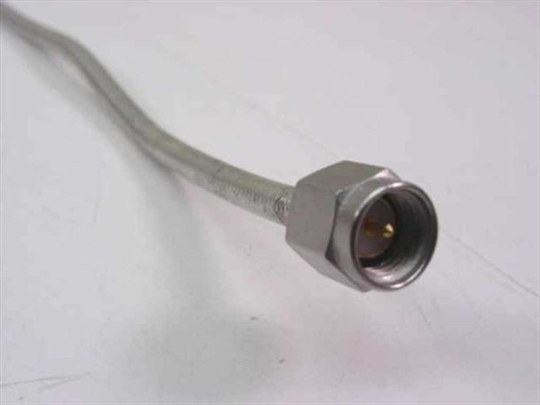 KMW 200086-017 — close-up of straight SMA male connector end showing stainless hex body and gold center pin