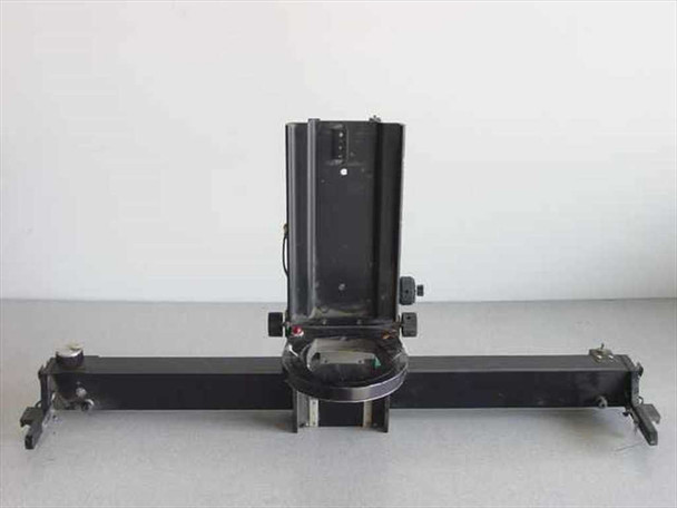 Custom optical apparatus with moveable lens housing on linear slide rail — front view showing full assembly