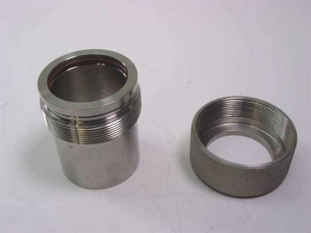 MDC 411012 vacuum fitting disassembled — tube body with threaded exterior and knurled collar ring separated