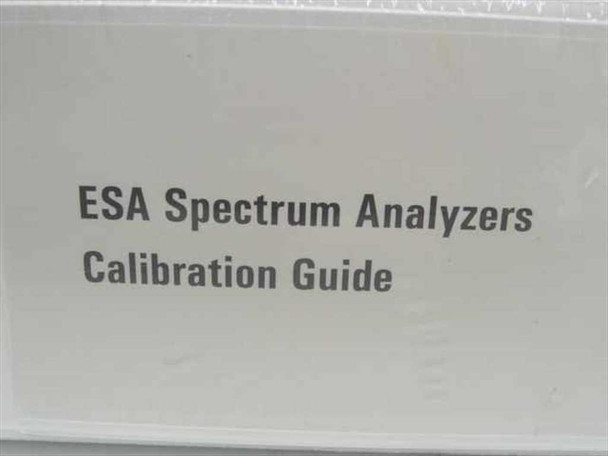 Agilent ESA Spectrum Analyzers Calibration Guide — close-up of cover label reading 'ESA Spectrum Analyzers Calibration Guide' visible through plastic wrap