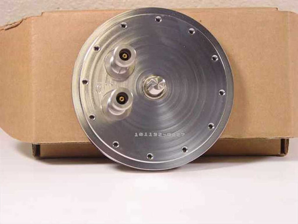 Omni Cap 101192-0027 vacuum chamber lid — underside/rear view showing part number stamped on disk, multiple bolt-circle mounting holes around perimeter, and three feedthrough port connections