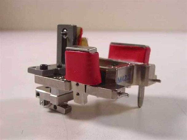 Guzik 304000 HLM head sub-assembly – front view showing two red-capped magnetic head modules in precision machined bracket