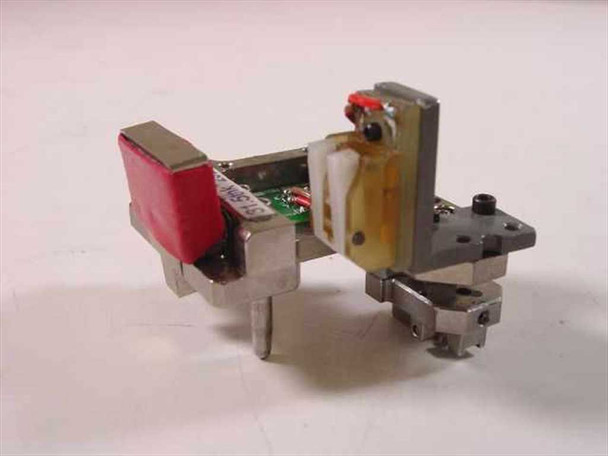 Guzik 2202 HLM head sub-assembly – side view showing small PCB, red-capped head module, and machined aluminum mount
