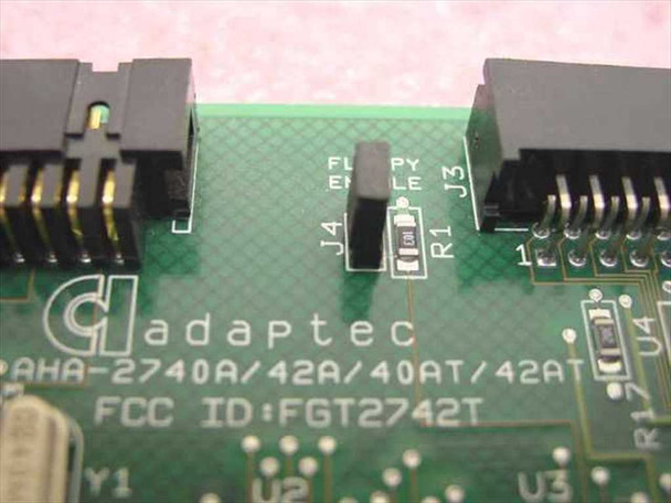 Adaptec AHA-2740A/42A/40AT/42AT PCB close-up showing Adaptec logo, model designation, FCC ID FGT2742T, and floppy enable jumper J4