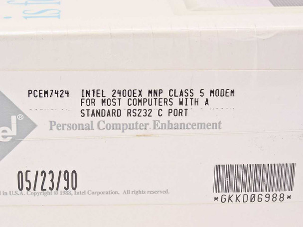 Intel 2400EX MNP Modem PCEM7424 — bottom label showing part number PCEM7424, manufacture date 05/23/90, and RS-232C compatibility note