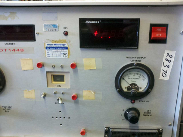 DT1448 right-side front panel showing Counter display, Analogic 5 DVM with red readout, Primary Supply Current Simpson microammeter, LCD window, Micro Metrology service label, and Test Mode Switch