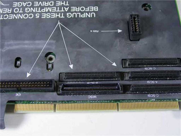 Compaq 304439-001 board edge showing SCSI slots labeled A-SCSI, C-SCSI, D-SCSI, MISC, and IDE connector along the card edge