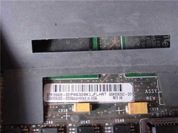 Compaq ProLiant 6000 motherboard label closeup — part number SP#169486-001, assembly AS#006352-001, Rev 0K, Assembled in USA