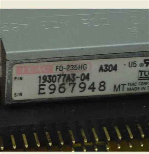 TEAC FD-235HG label closeup showing model FD-235HG, part number 193077A3-04, revision A304-U5, and serial number