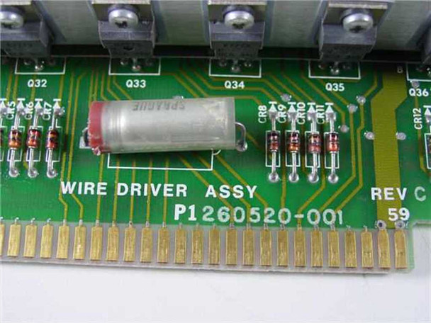 Dataproducts Wire Driver Assembly PCB close-up showing silkscreen label P1260520-001 Rev C with Sprague capacitor and diode array