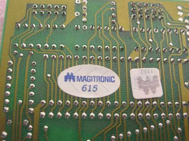 Magitronic 615 label on reverse side of ISA card PCB showing solder side traces and board identifier sticker