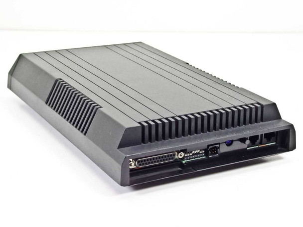 Microcom AX9624C external modem – rear-left three-quarter view showing DB25 RS-232 port, DIP switches, and RJ11 phone jacks