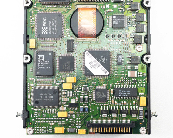 IBM 99F7834 SAA Hard Drive – close-up PCB view showing WDC, Intel 28C184-25, AMD, and Texas Instruments ICs