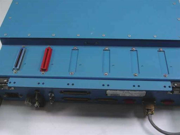 Harris TA-1023/G top rear view showing card slot bay area with red component, multiple expansion slot covers, and connector panel