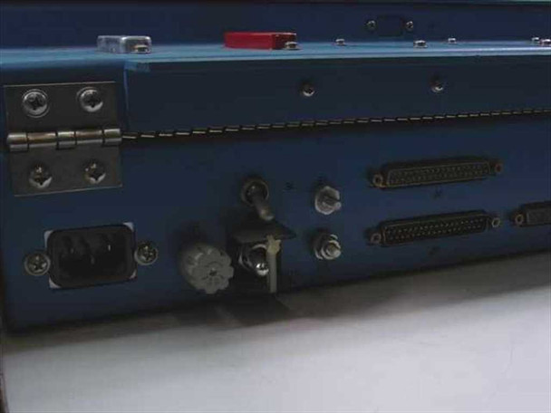 Harris TA-1023/G side panel detail showing DB9 connector, toggle switch, BNC connector, and two multi-pin D-sub connectors