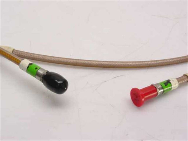 Thermax RG400/U cable ends with black and red protective dust caps installed on SMA connectors
