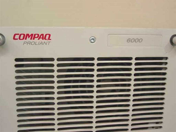 Compaq ProLiant 6000 nameplate closeup showing COMPAQ PROLIANT branding and model number 6000