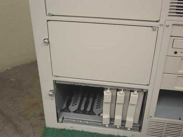 Compaq ProLiant 6000 lower front panel showing open expansion card cage with multiple installed cards