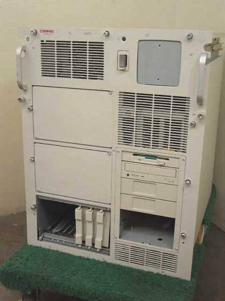 Compaq ProLiant 6000 ES2003 rackmount server — front panel view showing floppy drive, CD-ROM, expansion card slots, and ventilation panels