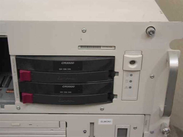 Compaq ProLiant CL1850 front drive bay section showing two CR3500 hot-swap drives installed with red handles and ELMON1 label below