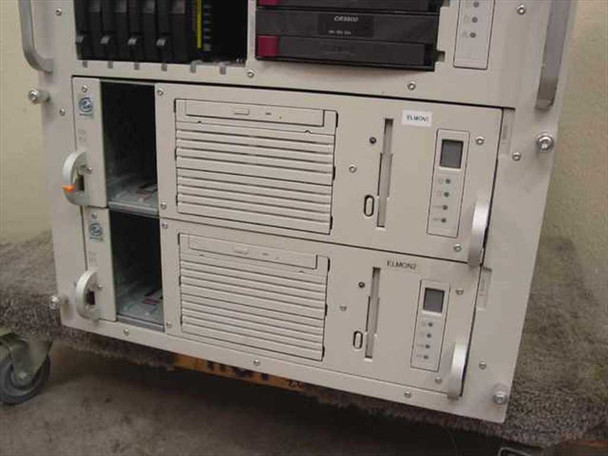 Compaq ProLiant CL1850 lower node enclosures front view showing ELMON1 and ELMON2 node bays with optical drives and indicator lights