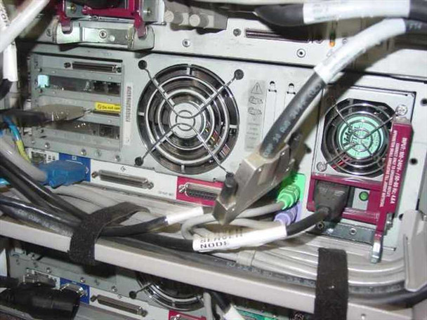 Compaq ProLiant CL1850 internal rear view showing cooling fans, expansion card slots, SCSI connectors, and multi-colored cabling