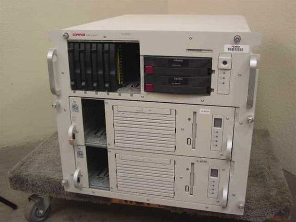 Compaq ProLiant CL1850 rack mount cluster server front view showing full chassis with hot-swap drive bays and lower node enclosures on a rolling cart