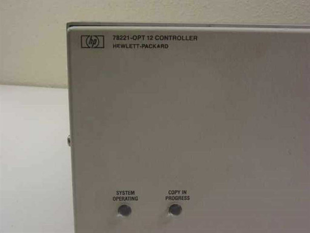 HP 78221-OPT 12 controller — front panel label closeup showing model name '78221-OPT 12 CONTROLLER HEWLETT-PACKARD' with System Operating and Copy In Progress indicator LEDs