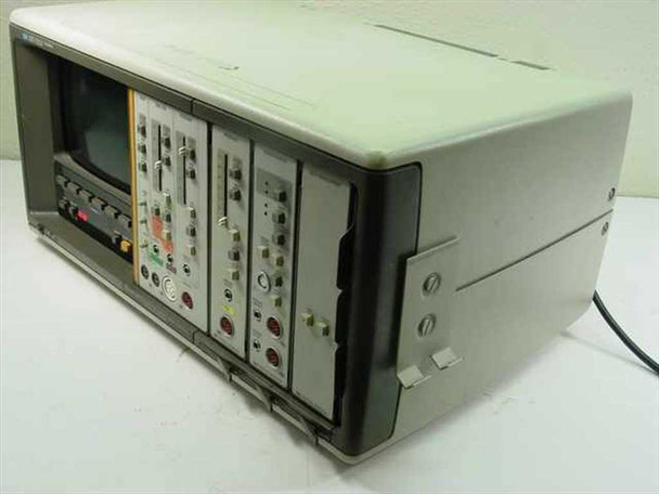 HP 78534C Monitor Terminal — front three-quarter view showing plug-in module bays, CRT display, and beige enclosure
