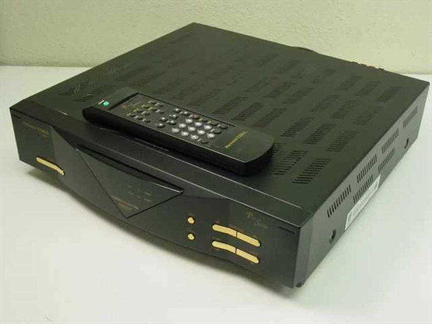 Uniden Personal Cable Pro Series PC4000 satellite receiver – three-quarter front view with remote control resting on top
