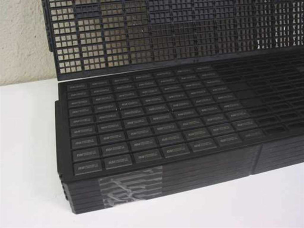 Side view of multiple stacked TSOP IC carrier trays containing ISSI IS42S16100A1-7T SDRAM chips