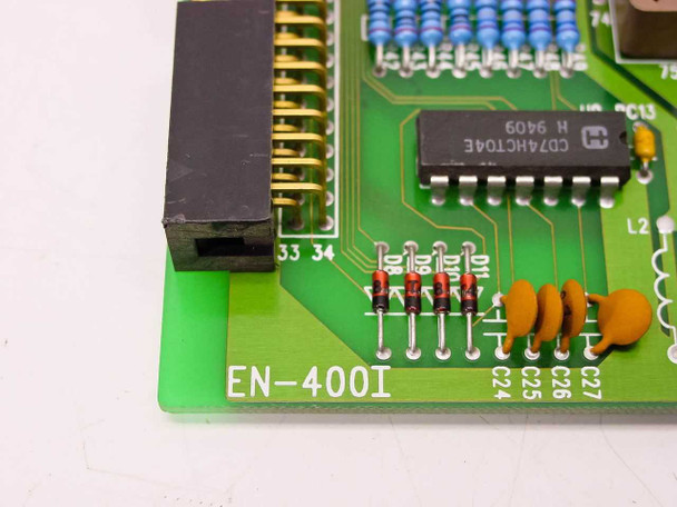 Close-up of Danpex EN-400I PCB corner showing 'EN-400I' silkscreen, CD74HCT04E IC, and resistor components