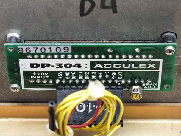 Rear label of Acculex DP-304 module showing part number 8670109, model designation DP-304, Acculex branding, and terminal pinout (±20V INPUT, GND, DPC, DP0–DP3, IN, N, R-OUT, SPAN ADJ)