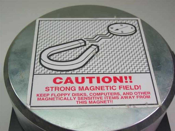 Ultratech Stepper electro magnet assembly – close-up of CAUTION strong magnetic field warning label on top of aluminum housing