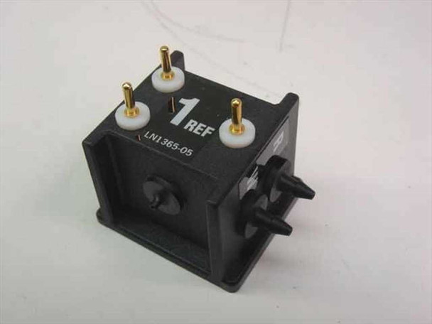 Abbott 1365-05 LN1365-05 Reference Electrode — front and left side view showing gold-pin contacts, white gaskets, and barbed fluid ports on black body