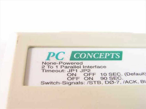 PC Concepts label closeup — reads 'None-Powered 2 To 1 Parallel Interface' with JP1/JP2 jumper timeout settings: ON/OFF=10 sec default, OFF/ON=90 sec, and switch signals /STB, D0-7, /ACK